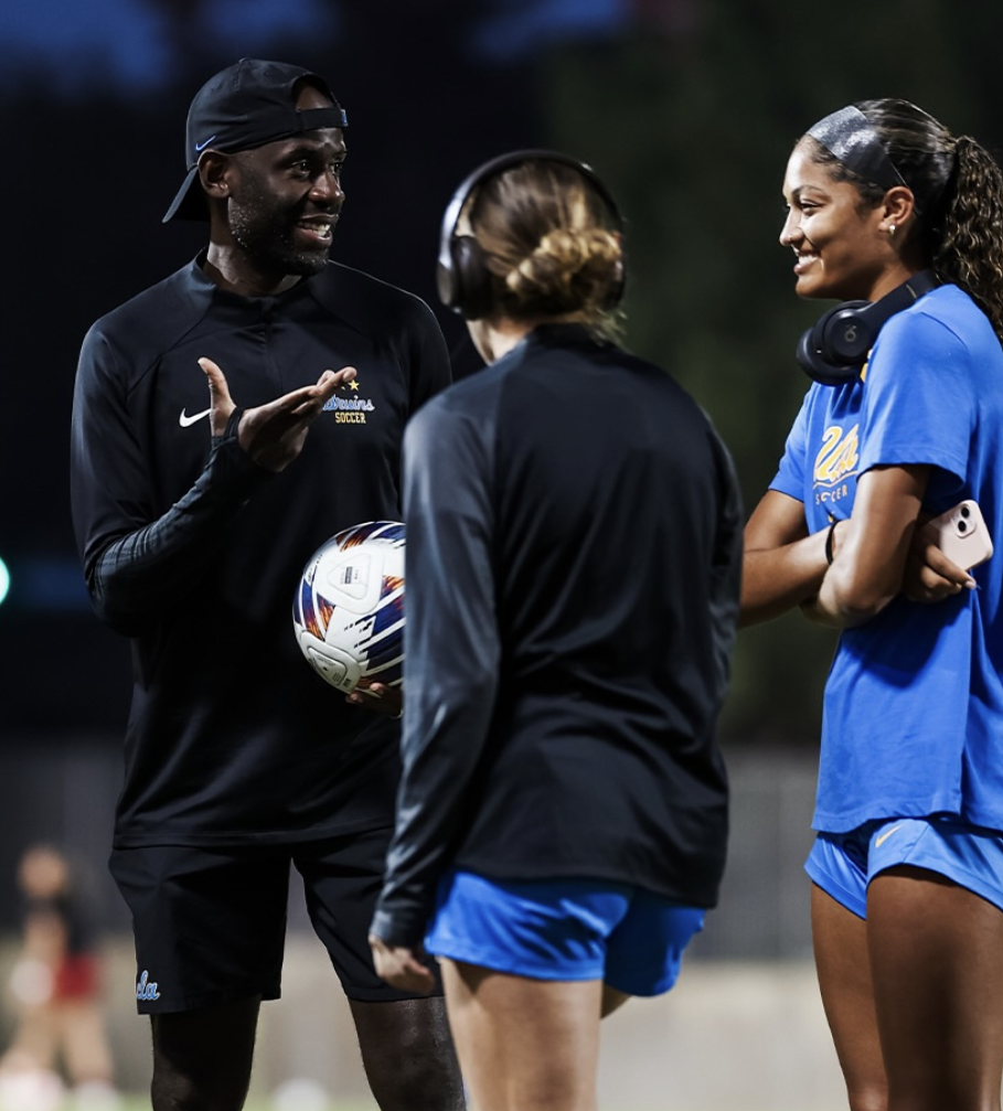 Coach Gof Buyoko talking with UCLA players